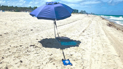 ShadeSecure beach umbrella stabilizer video installed on umbrella in windy beach conditions.
